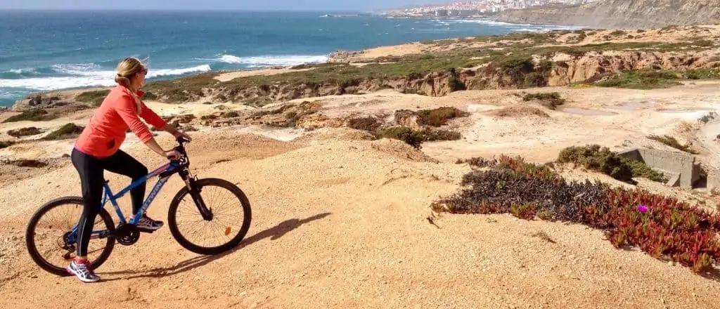 Girl on a mountain bike enjoying one of the trails in Ericeira