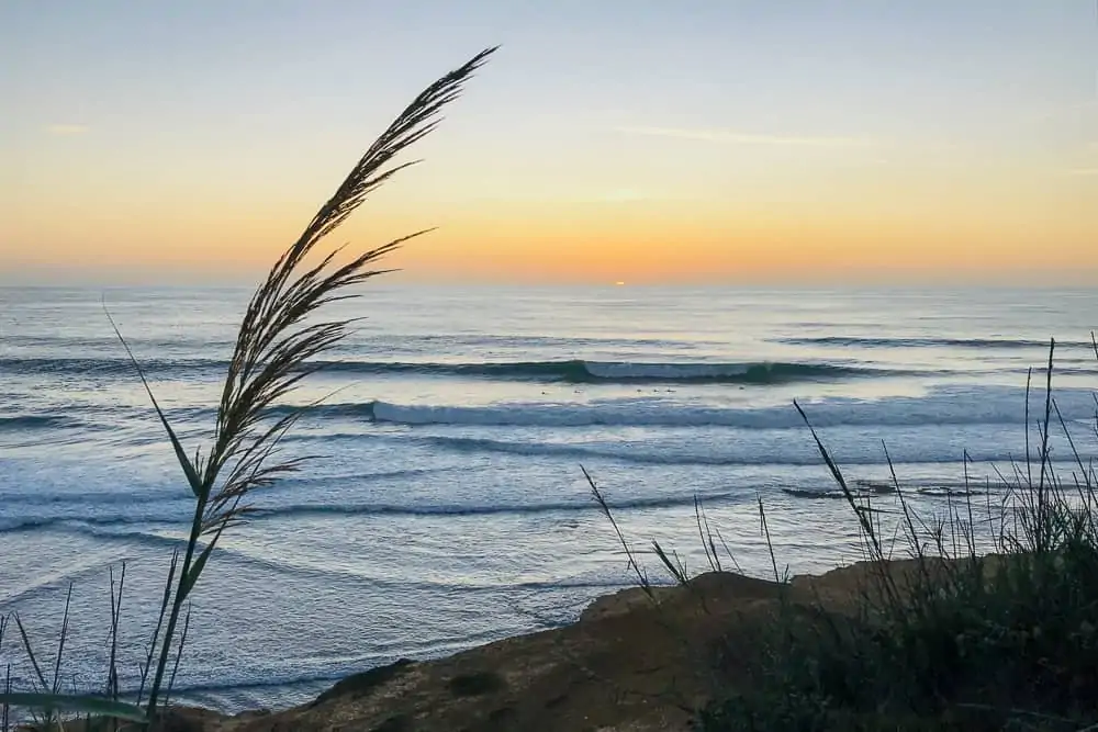 Surfers enjoying a nice sunset surf at Paparucos