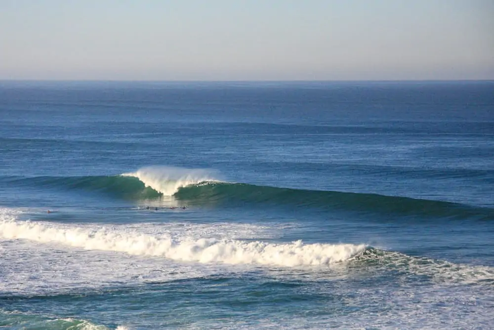Surfers enjoying perfect conditions at Praia do Sul