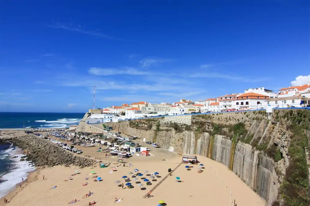 The harbour of Ericeira with its cozy beach and the village on top of the cliffs