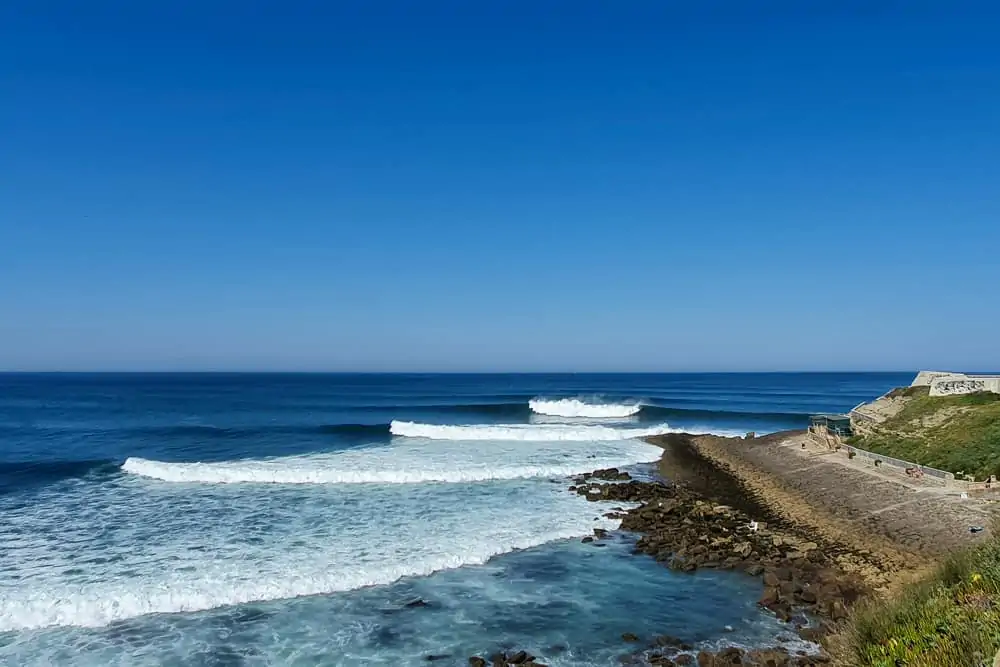 The famous righthand wave on the south side of Forte da Praia da Consolação